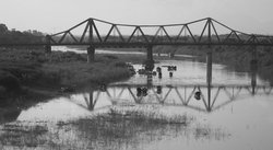 Boats under Long Bien Bridge